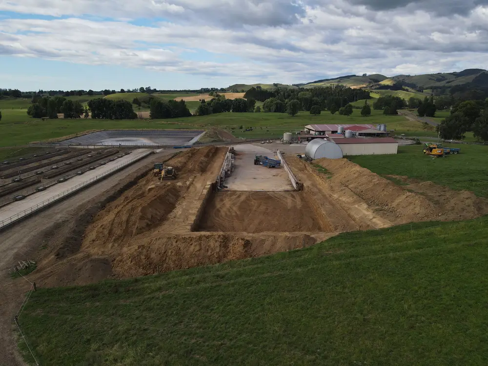 Earthworks site with bunker and culvert, ranges on the horizon